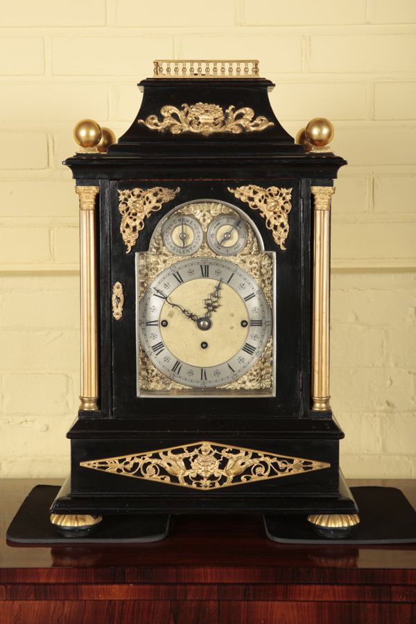 AN IMPRESSIVE EBONISED AND GILT METAL MOUNTED BRACKET CLOCK