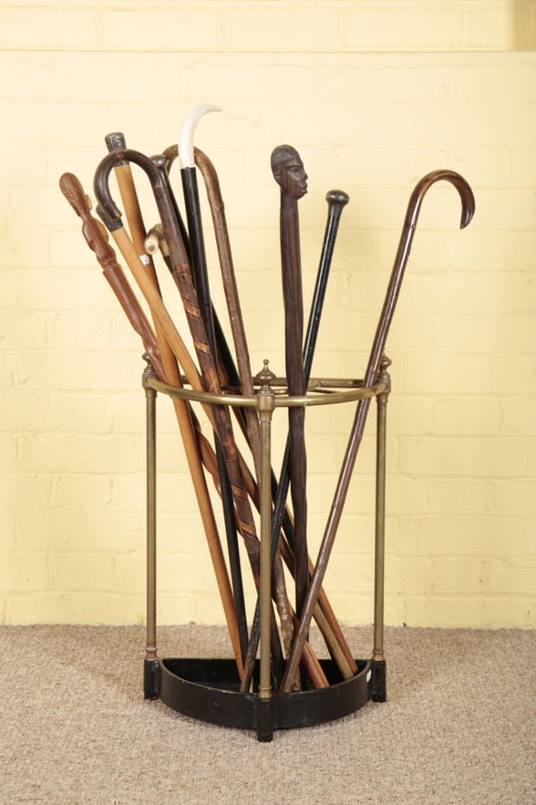 A VICTORIAN BRASS AND CAST IRON STICK STAND