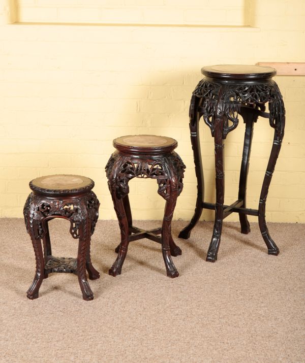 AN ASSOCIATED SET OF THREE CHINESE HARDWOOD JARDINIERE STANDS