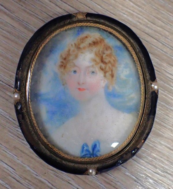 A 19th CENTURY PORTRAIT  MINIATURE OF A YOUNG WOMAN