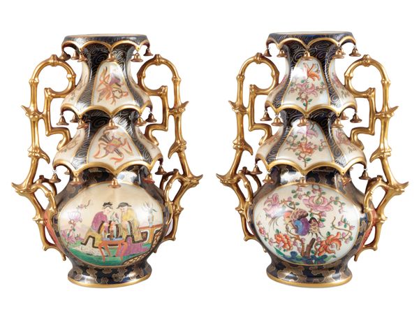 A PAIR OF CONTINENTAL PORCELAIN 'PAGODA' VASES