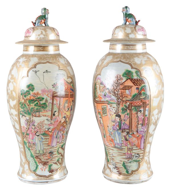 A PAIR OF CONTINENTAL PORCELAIN FAMILLE ROSE BALUSTER VASES AND COVERS