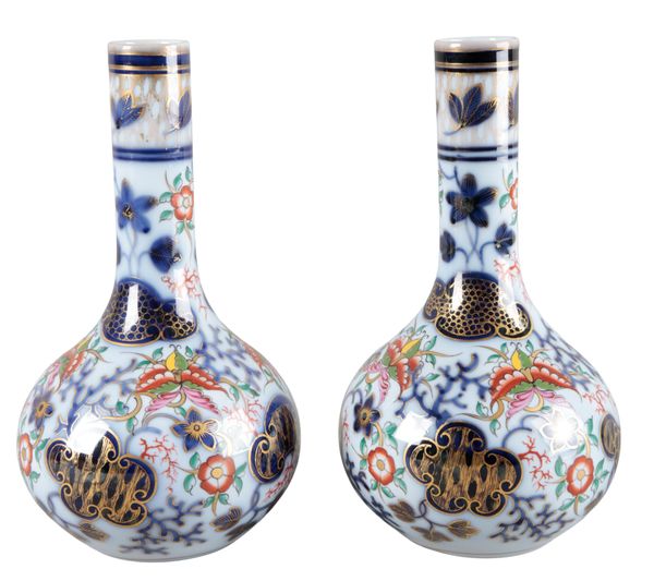 A PAIR OF CONTINENTAL PORCELAIN BOTTLE VASES