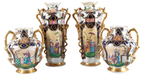 A PAIR OF CONTINENTAL PORCELAIN FACETED VASES