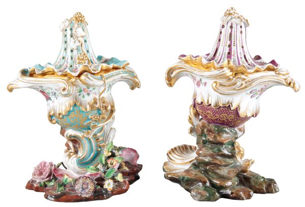 A NEAR PAIR OF PORCELAIN URNS AND COVERS BY JACOB PETIT