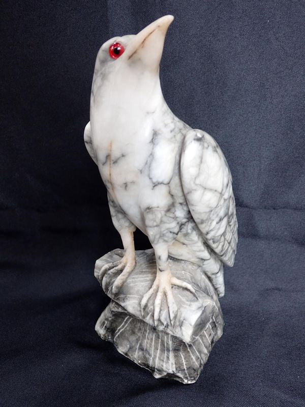 A CARVED ALABASTER BIRD OF PREY