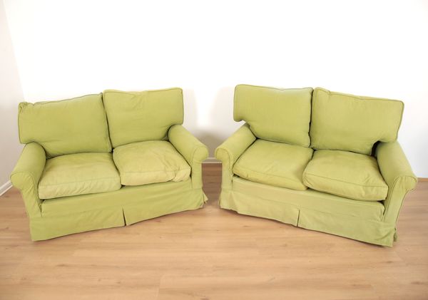 TWO LIME GREEN LINEN UPHOLSTERED TWO SEATER SOFAS