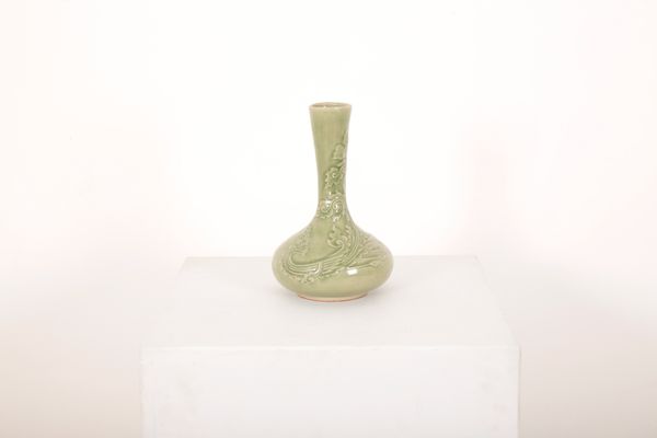 A CELADON GLAZED STONEWARE BOTTLE SHAPED VASE