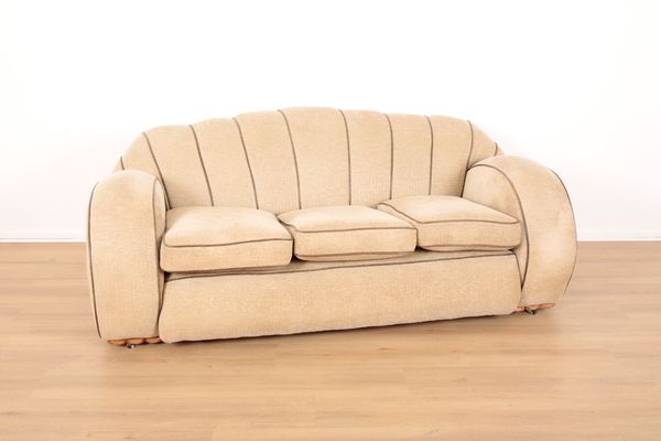 A BEIGE UPHOLSTERED ART DECO SOFA