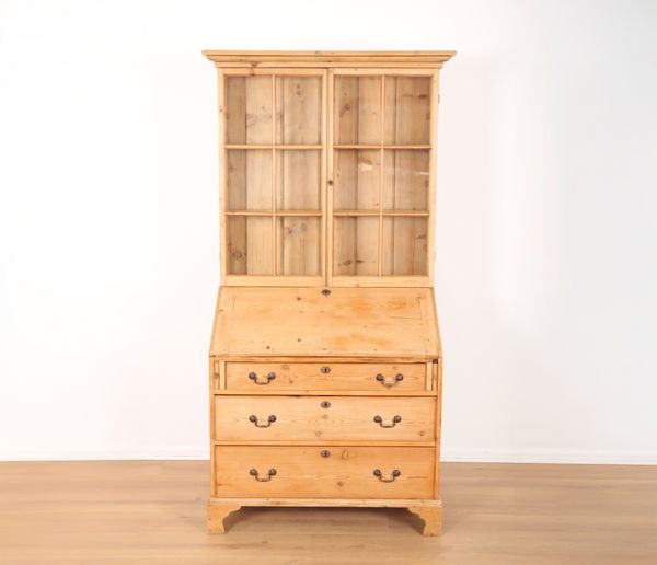 A STRIPPED PINE BUREAU BOOKCASE