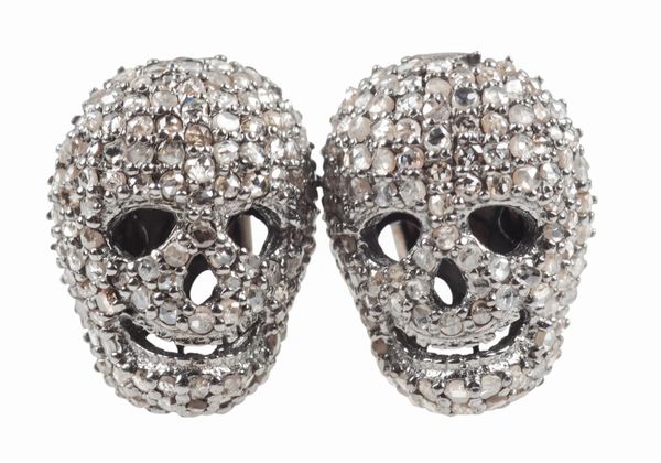 A PAIR OF DIAMOND SET SKULL CUFFLINKS