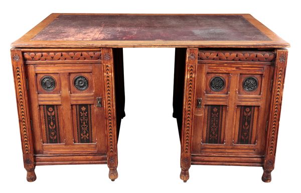 A LARGE ARTS AND CRAFTS PINE PARTNER'S DESK