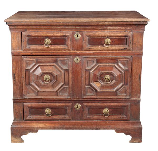 AN ENGLISH OAK CHEST OF DRAWERS