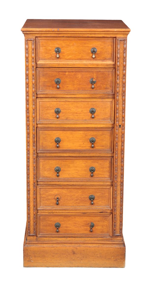 AN OAK WELLINGTON CHEST