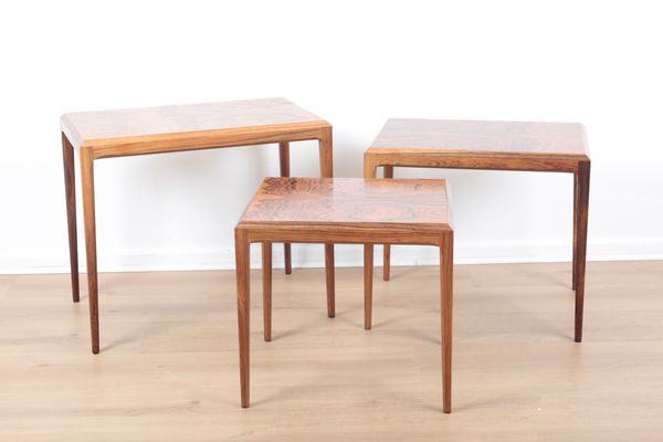 JOHANNES ANDERSEN FOR CFC SILKEBORG: A NEST OF THREE DANISH ROSEWOOD TABLES