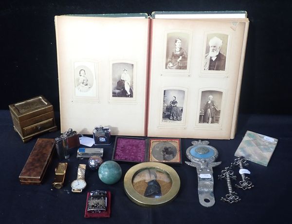 A LEATHER CASED AMBROTYPE PHOTOGRAPH OF A FAMILY SCENE