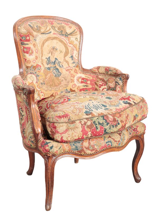 A LOUIS XV BEECHWOOD BERGERE ARMCHAIR