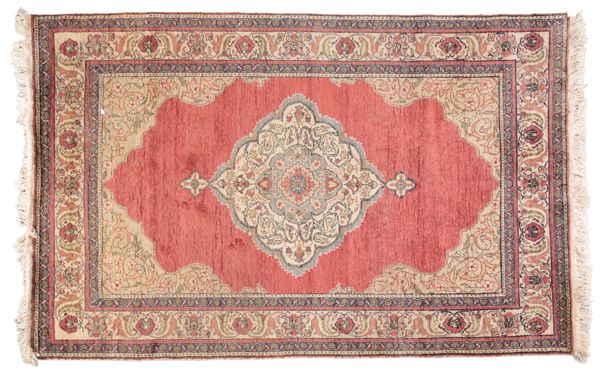 A PERSIAN SILK RUG