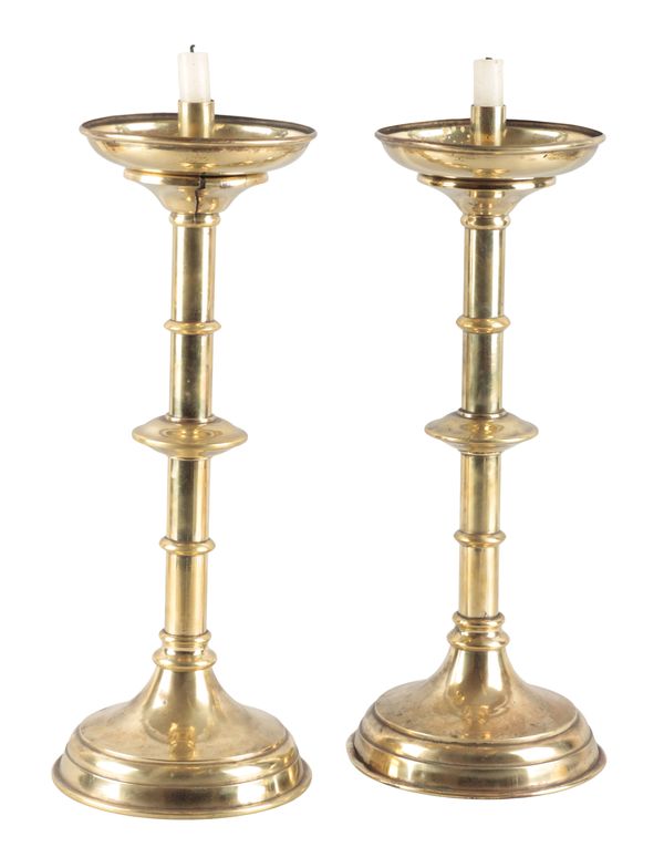 A PAIR OF LARGE BRASS CANDLESTICKS