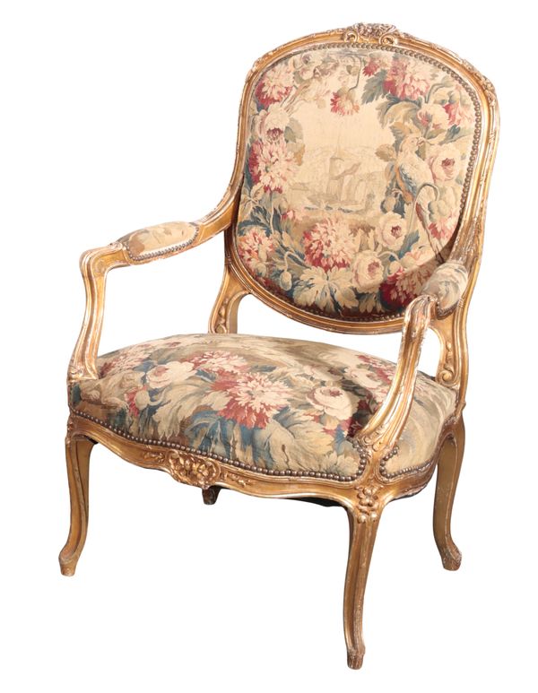 A LOUIS XV STYLE GILTWOOD ARMCHAIR