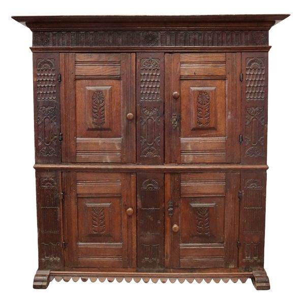 A CONTINENTAL OAK CUPBOARD