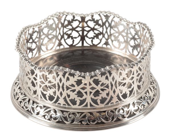 A VICTORIAN SILVER BOTTLE COASTER