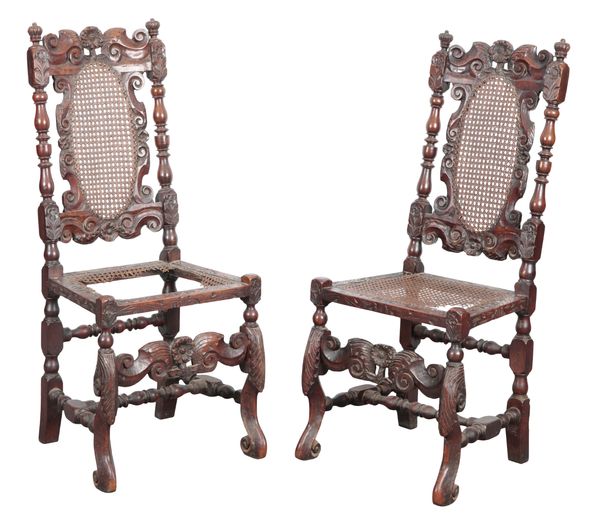 A PAIR OF CHARLES II WALNUT AND CANED HIGH BACK CHAIRS