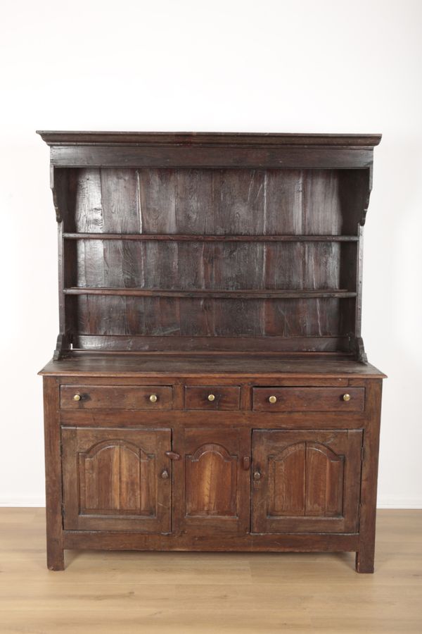 A PANELLED OAK DRESSER