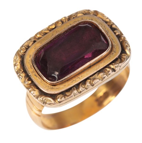 AN ANTIQUE AND LATER GARNET MOURNING RING