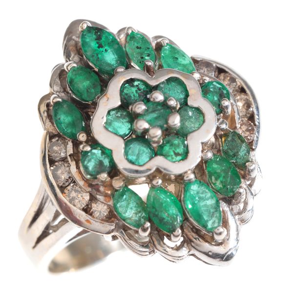 AN EMERALD AND DIAMOND CLUSTER RING