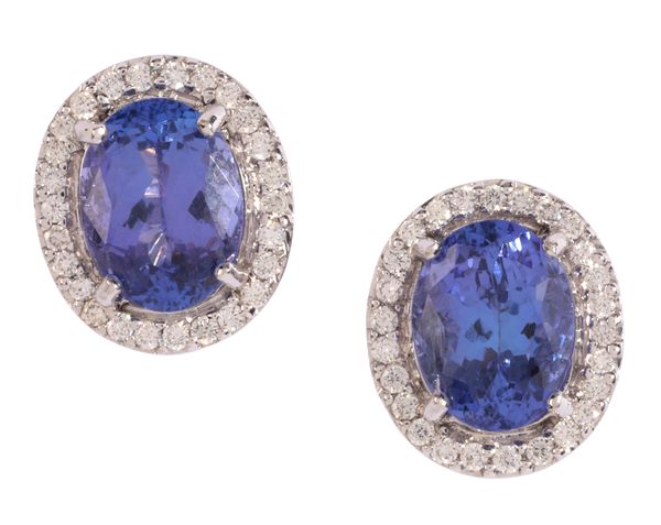 A PAIR OF TANZANITE AND DIAMOND CLUSTER EARRINGS