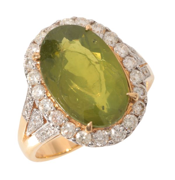 A PERIDOT AND DIAMOND CLUSTER RING