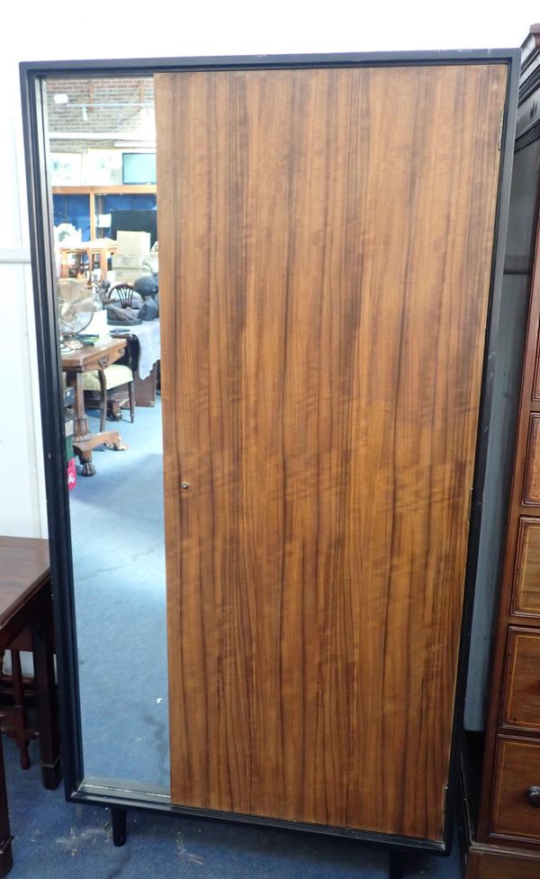 A MID-CENTURY STAG WALNUT WARDROBE BY JOHN AND SYLVIA REID