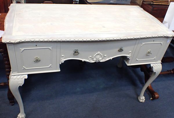 A PAINTED MAHOGANY DESK, ON CABRIOLE LEGS