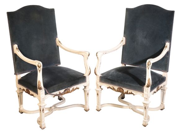 A PAIR OF CONTINENTAL WHITE PAINTED AND PARCEL GILT ARMCHAIRS