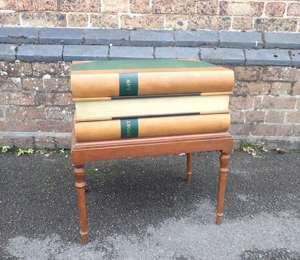 A 20TH CENTURY PAINTED MAHOGANY ‘STACK OF BOOKS’ COFFEE TABLE