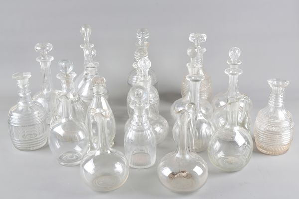 A LARGE COLLECTION OF CUT-GLASS DECANTERS