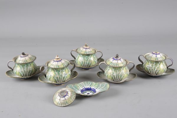 A SET OF FIVE ENAMEL TWO-HANDLED CUPS, COVERS AND STANDS