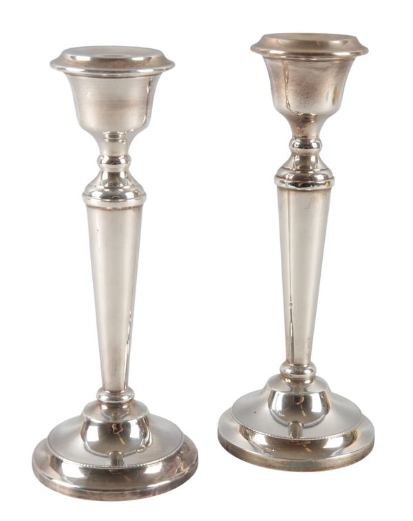 A PAIR OF ELIZABETH II SILVER CANDLESTICKS