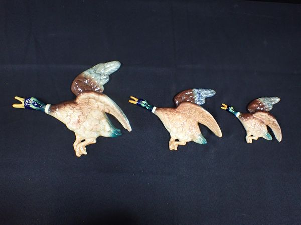 A SET OF THREE FLACON WARE FLYING DUCKS