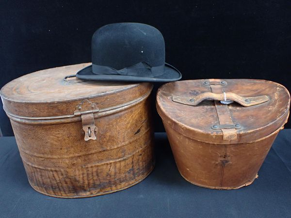 A VINTAGE LEATHER TOP HAT CASE, A BOWLER HAT