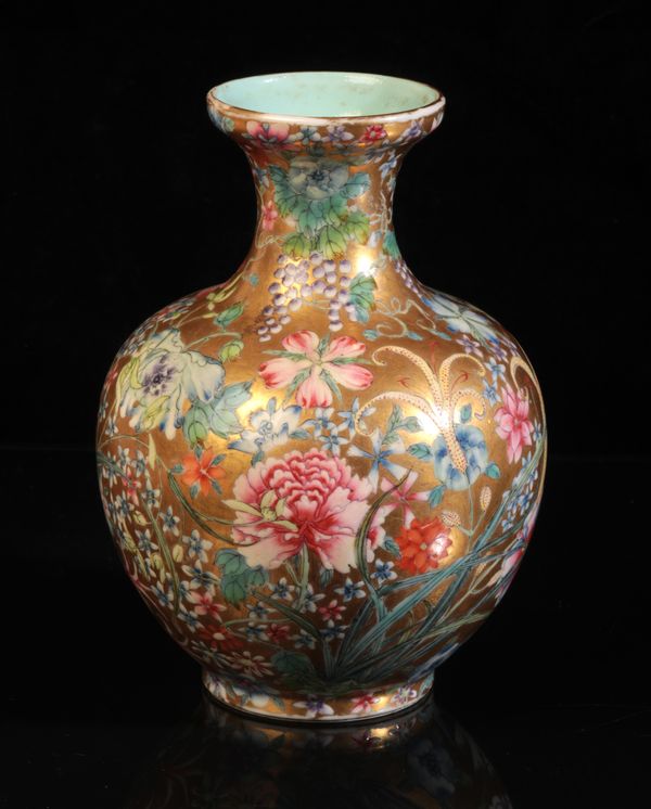 A CHINESE PORCELAIN 'HUNDRED FLOWERS' FAMILLE ROSE VASE