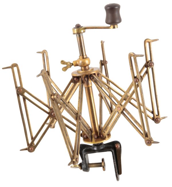 C. FARLOW & CO LTD OF LONDON: A SEXTILE BRASS FOLDING LINE WINDER