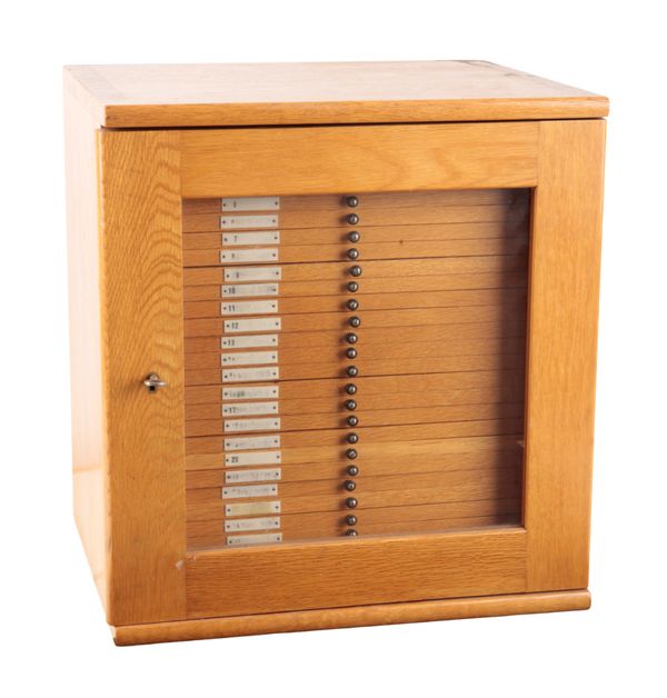 AN EDWARDIAN LIGHT OAK COLLECTORS CABINET