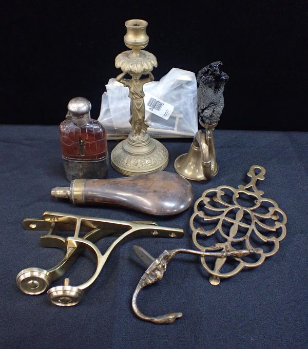 A BRASS FIGURAL CANDLESTICK