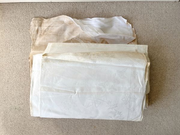 A COLLECTION OF WHITE DAMASK TABLE LINENS