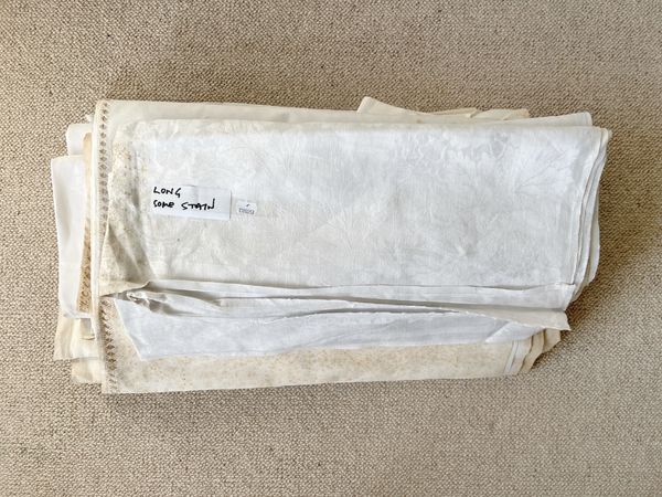A COLLECTION OF WHITE DAMASK TABLE LINENS