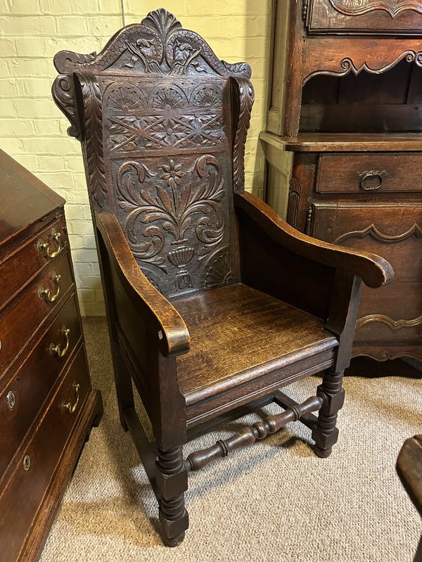 A WAINSCOT OAK ARMCHAIR IN 17TH CENTURY STYLE