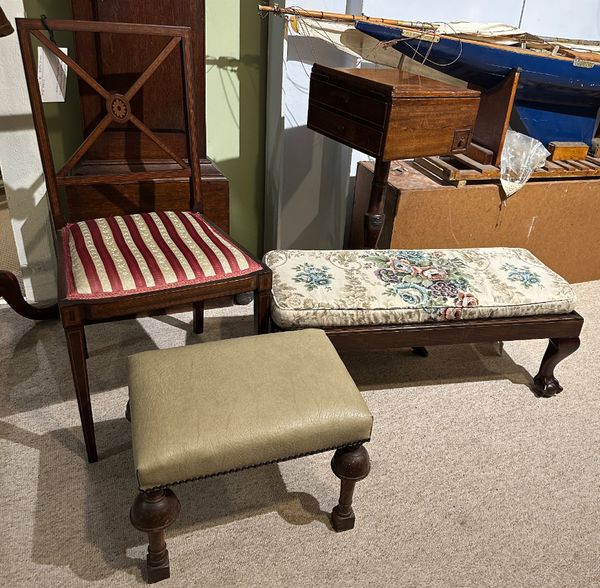 A MAHOGANY LONG LOW STOOL WITH BALL AND CLAW FEET