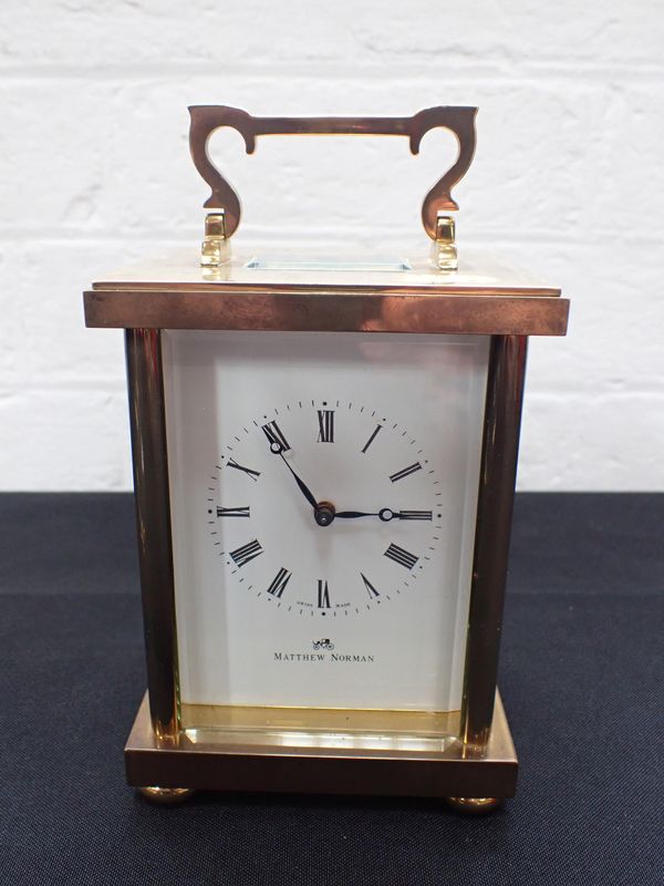 A MATTHEW NORMAN BRASS CARRIAGE CLOCK